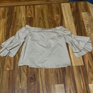 Off shoulder Jennifer Lopez shirt